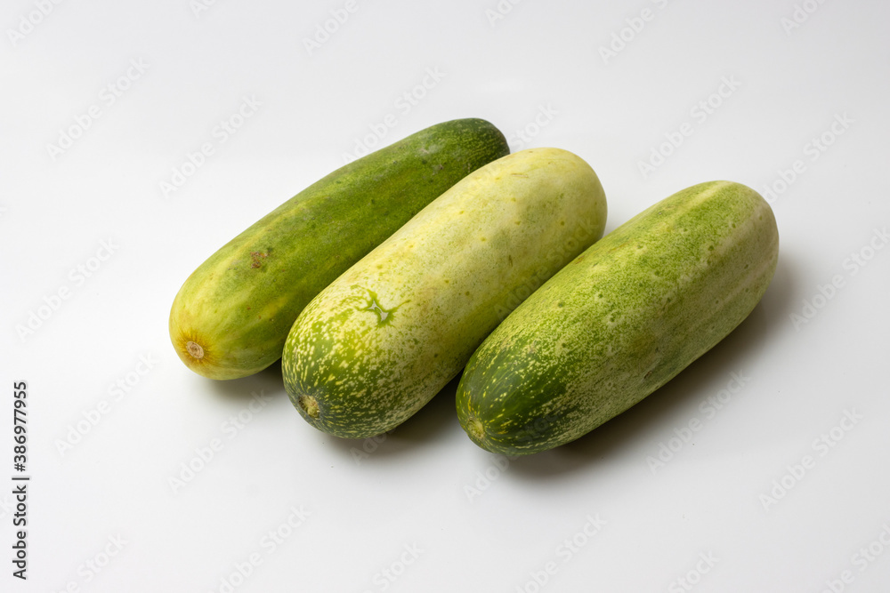Fresh green cucumbers on white background Fresh green cucumbers on white background