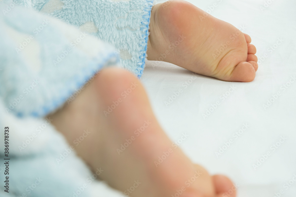feet sleeping baby sticking out from under the blanket feet sleeping baby sticking out from under the blanket