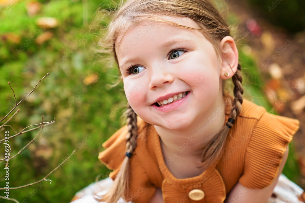 Cute and fashion child girl in autumn park Cute and fashion child girl in autumn park