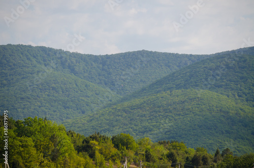 Landscape with mountains and clouds on a bright day