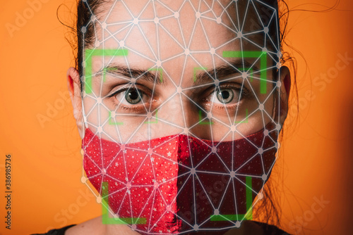Woman with face mask using facial recognition AI system, artificial Intelligence . Biometric scanning Face ID facial mask
