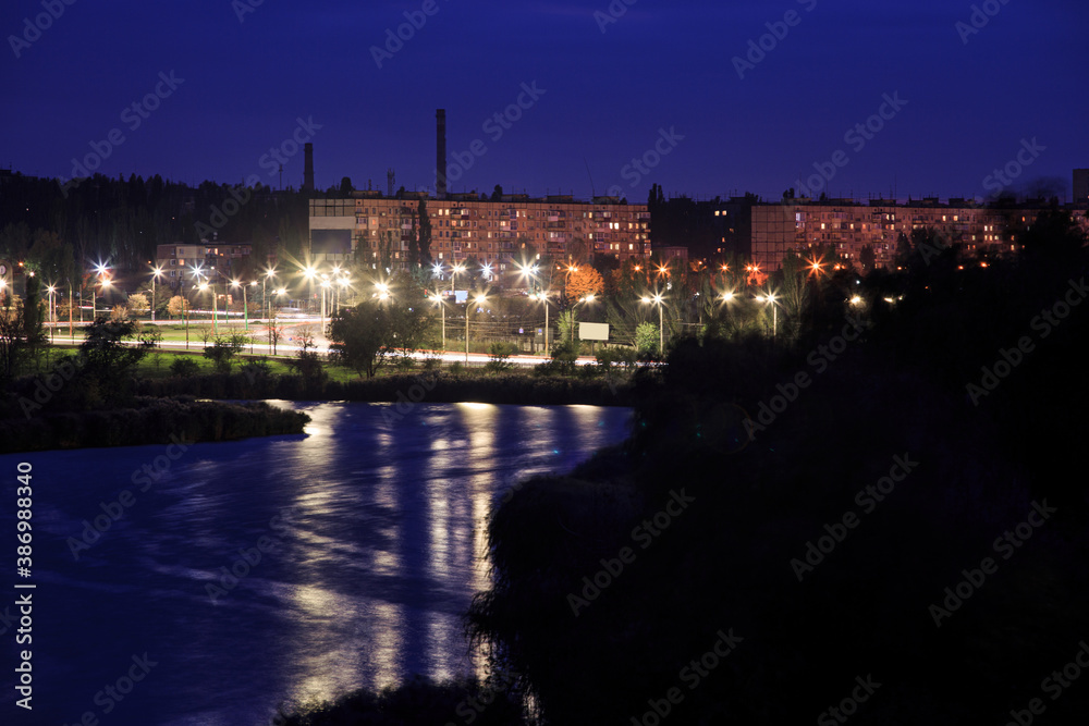 River on the outskirts of the city in Eastern Europe in the evening