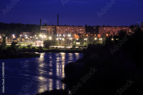 River on the outskirts of the city in Eastern Europe in the evening