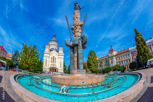Statue of Avram Iancu and orthodox cathedral, Cluj Napoca, Romania photo