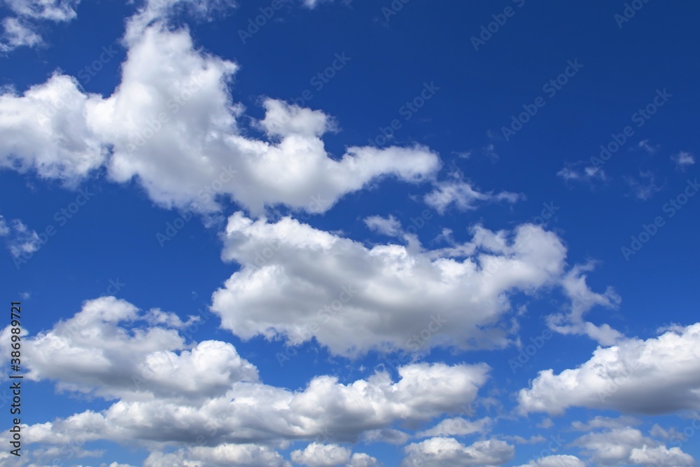 beautiful fluffy clouds on a bright blue summer sky beautiful fluffy clouds on a bright blue summer sky