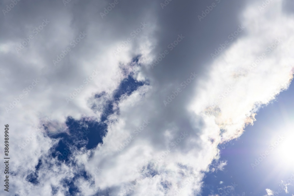 white cumulus clouds against a bright blue sky white cumulus clouds against a bright blue sky