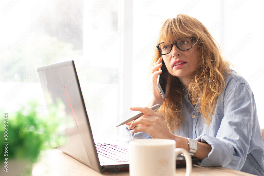 business woman working with computer and mobile phone business woman working with computer and mobile phone
