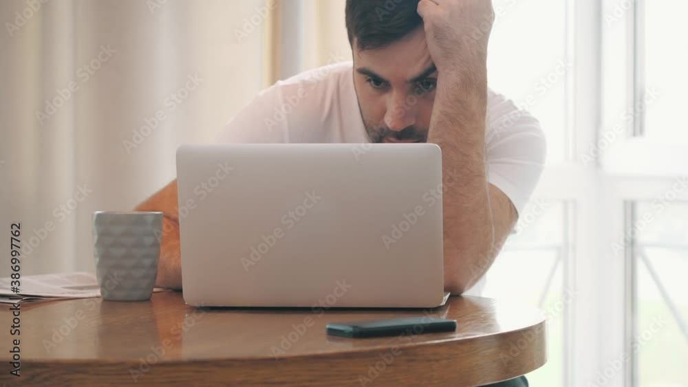 4k slowmotion video of young man having hard time working. 4k slowmotion video of young man having hard time working.