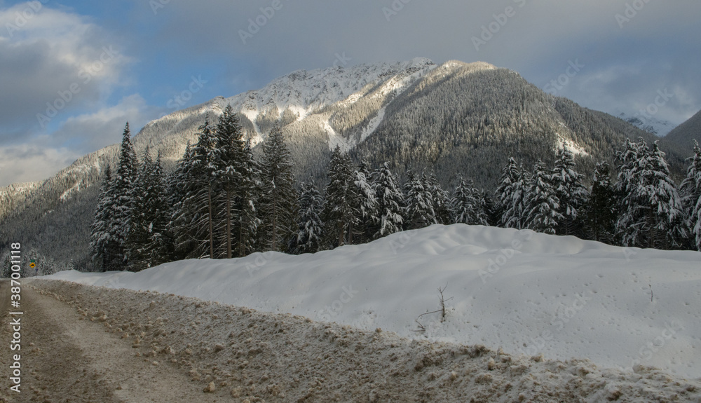 Winter rocky mountain view from the Trans Canada Highway in British Columbia near Rogers pass good driving conditions 