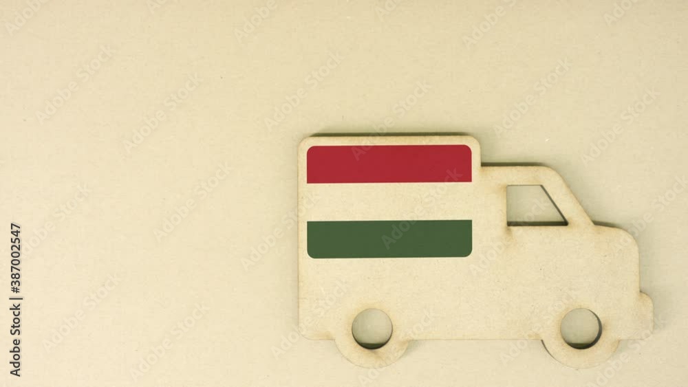 Flag of Hungary on the recycled cardboad truck icon, national sustainable logistics concept Flag of Hungary on the recycled cardboad truck icon, national sustainable logistics concept
