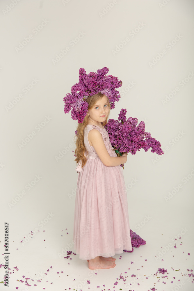 Little cute bright girl in the studio with lilac Little cute bright girl in the studio with lilac