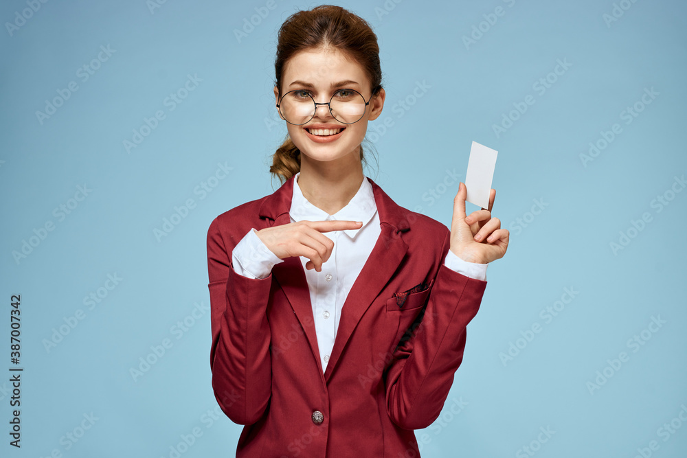 Elegant woman red jacket business card official confident lifestyle blue background Elegant woman red jacket business card official confident lifestyle blue background