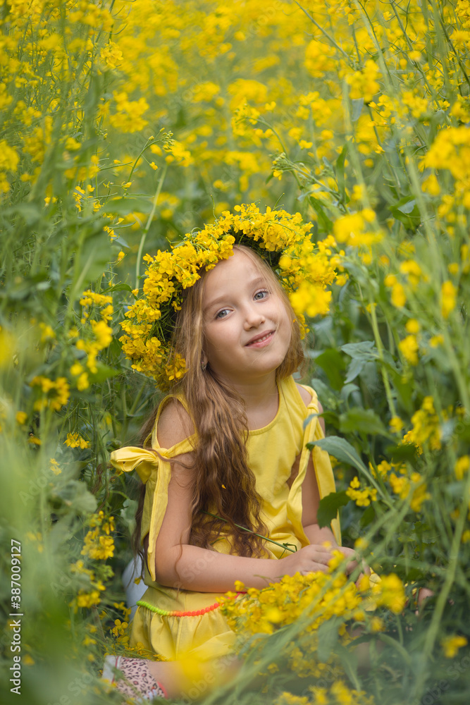 Little cute blonde girl on a rapeseed field Little cute blonde girl on a rapeseed field