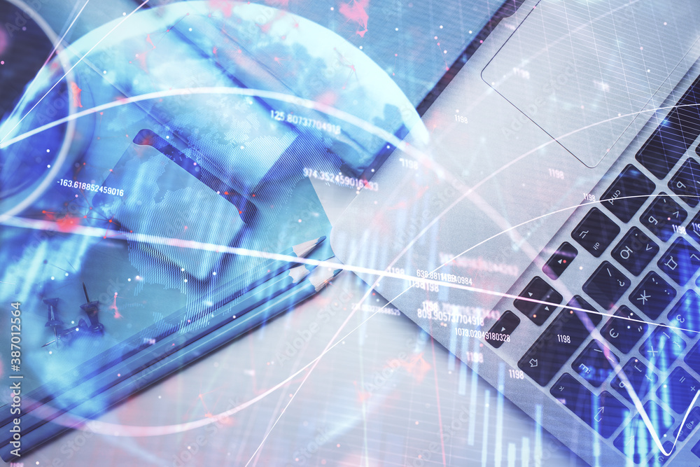 Double exposure of forex graph drawing over desktop background with computer. Concept of financial analysis. Top view. Double exposure of forex graph drawing over desktop background with computer. Concept of financial analysis. Top view.