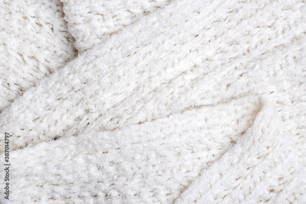 White knitted texture and background, close up. White knitted texture and background, close up.