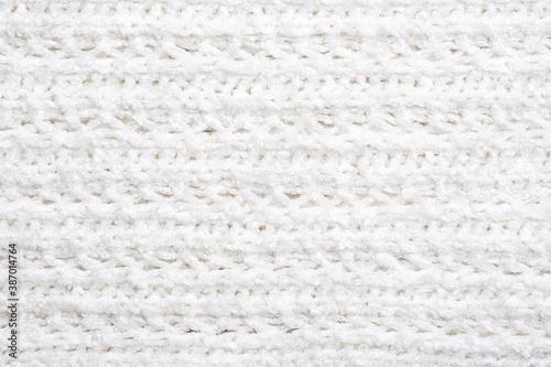 White knitted texture and background, close up.