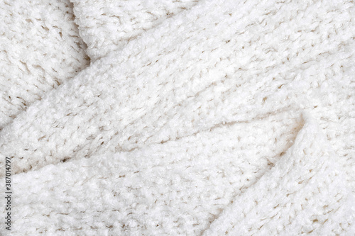 White knitted texture and background, close up.