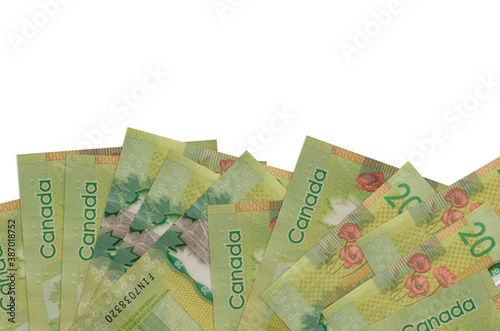 20 Canadian dollars bills lies on bottom side of screen isolated on white background with copy space. Background banner template photo