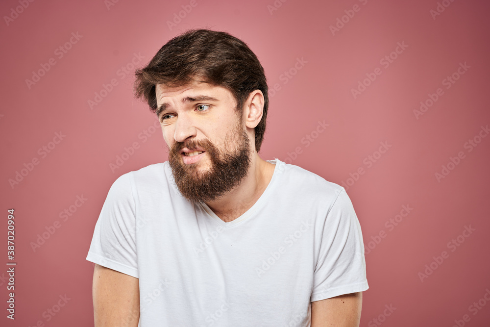 emotional man white t shirt sad facial expression pink background emotional man white t shirt sad facial expression pink background