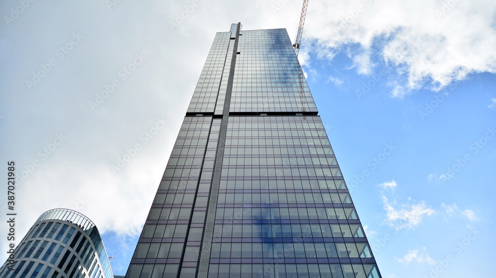 Obraz premium Bottom view of modern office buildings in the business district