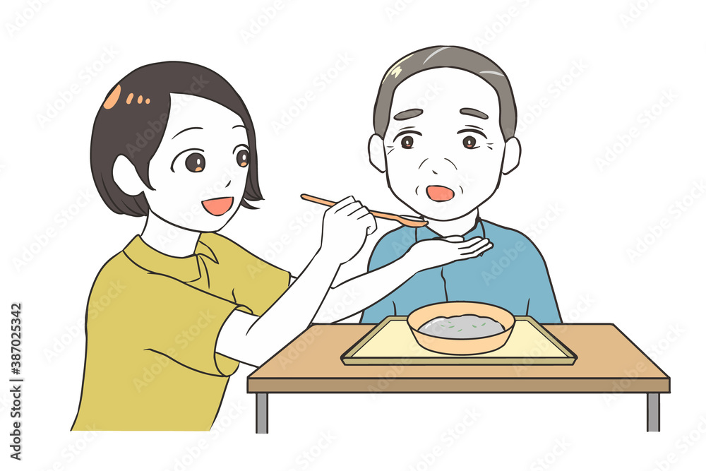高齢男性の食事を介助する 女性介護士 高齢男性の食事を介助する 女性介護士