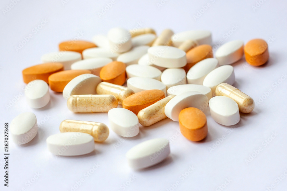Different pharmaceutical medicine pills, tablets and capsules on white background. Pharmacy theme, health care, drug prescription for treatment medication and medicament. Different pharmaceutical medicine pills, tablets and capsules on white background. Pharmacy theme, health care, drug prescription for treatment medication and medicament.