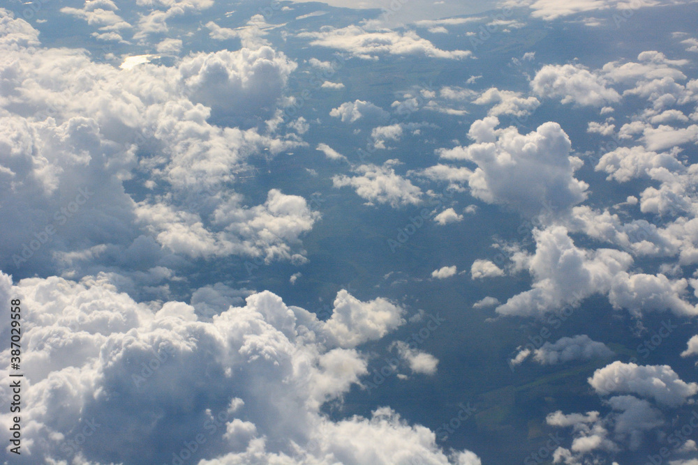 fluffy clouds in the sky shot from plane fluffy clouds in the sky shot from plane