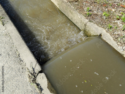 大雨後の増水した農業用水路 photo