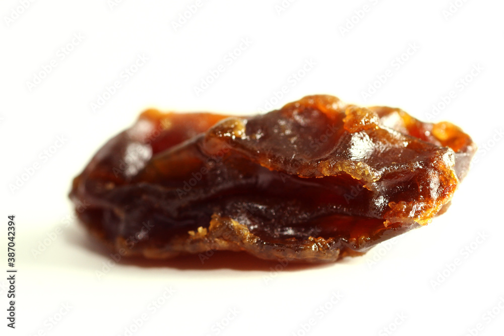 Macro of dehydrated grape fruit on white background Macro of dehydrated grape fruit on white background