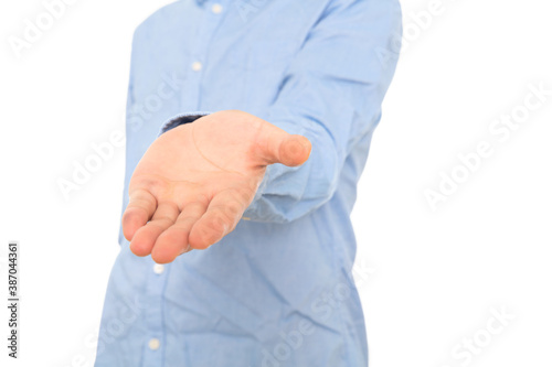 Man in blue shirt stretches out his hand