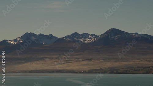 New Zealand autumn season landscape with mountains during sunset in Mt.Cook area with lake. photo