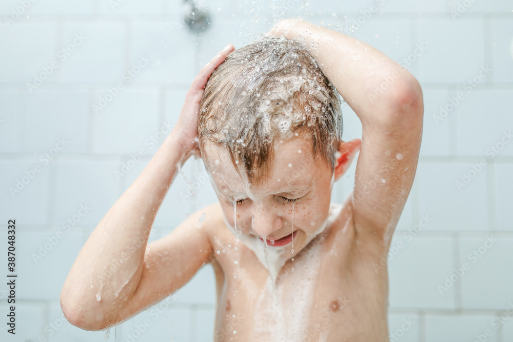 little boy washes in the shower little boy washes in the shower