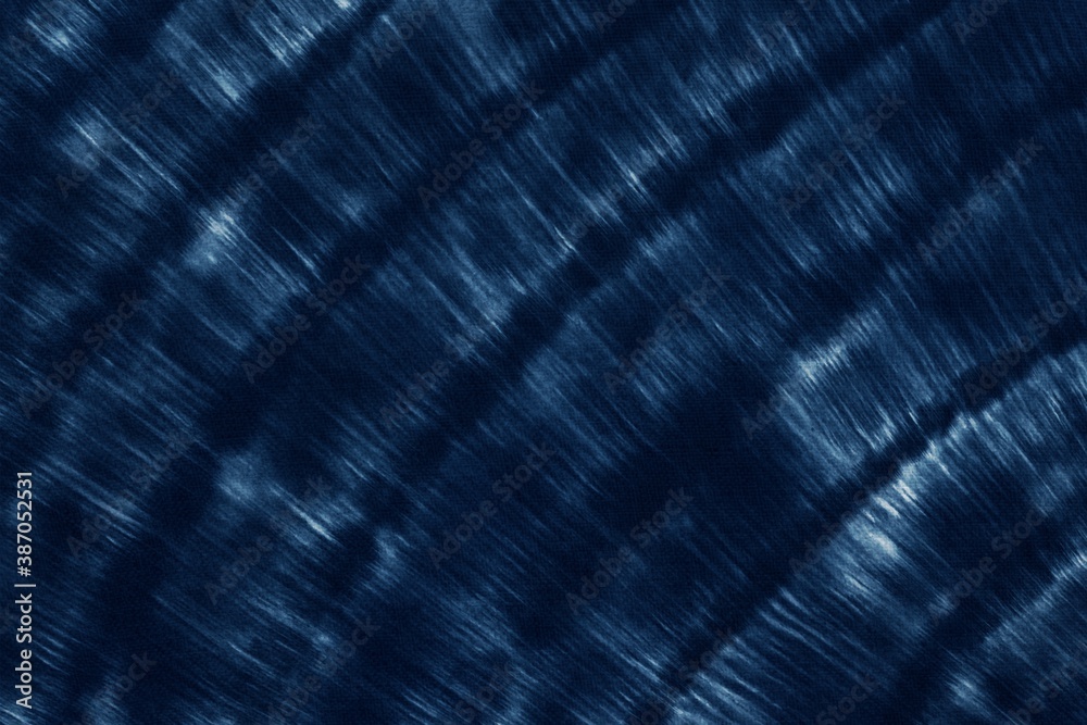 Indigo Blue Shibori Tie dye fabric texture pattern. White and Blue colors. Indigo Blue Shibori Tie dye fabric texture pattern. White and Blue colors.