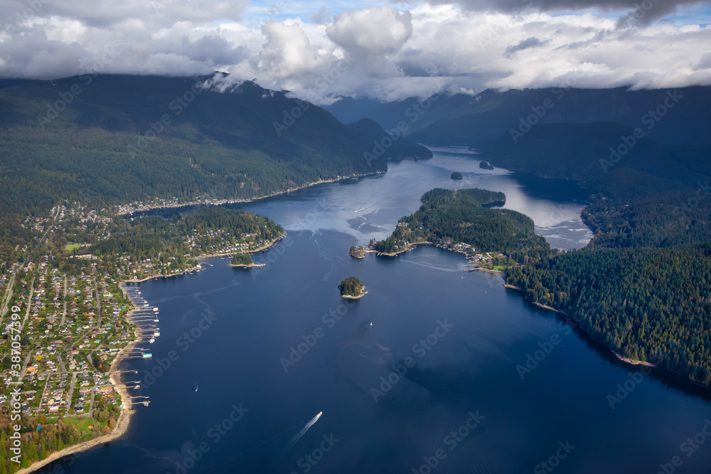 Aerial view of an Ocean Inlet in a modern city during a cloudy morning. Taken in Deep Cove, Vancouver, British Columbia, Canada.