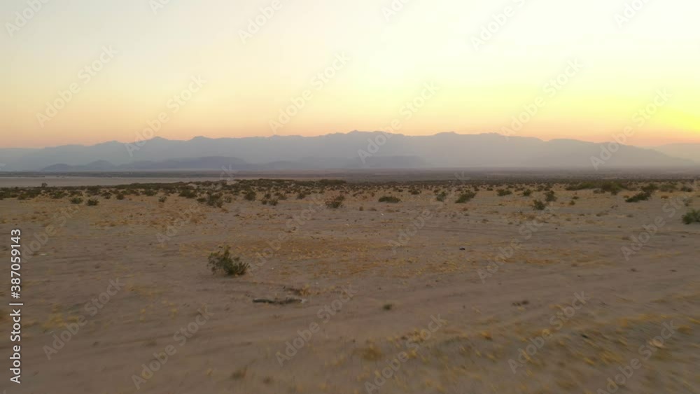 Sunset in the desert of the salt lake of mexicali baja california mexico, place used for some migrants to try cossing the border tu US,