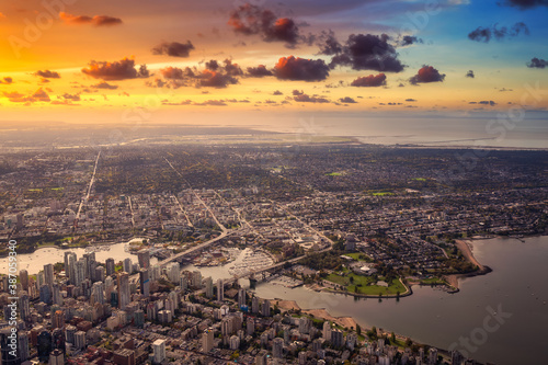 Aerial View of Downtown Vancouver City, British Columbia, Canada. Colorful Sunrise Artistic Render. Modern Cityscape from above.