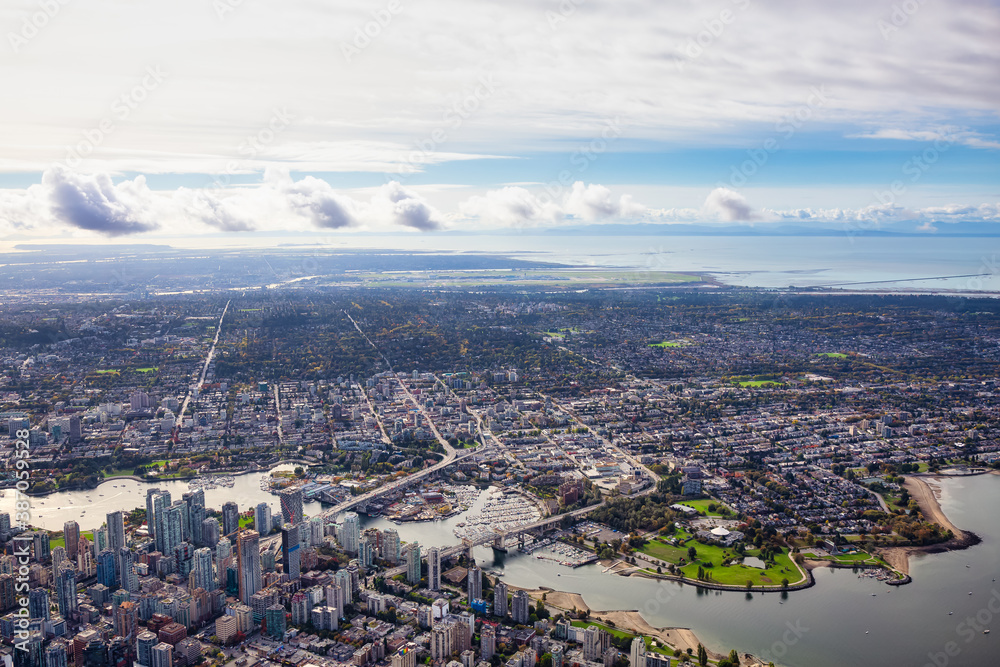 Aerial View of Downtown Vancouver City. Taken during a bright sunny morning in British Columbia, Canada. Modern Cityscape from above.