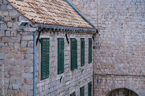 Dubrovnik old town medieval building stone wall background and roof
