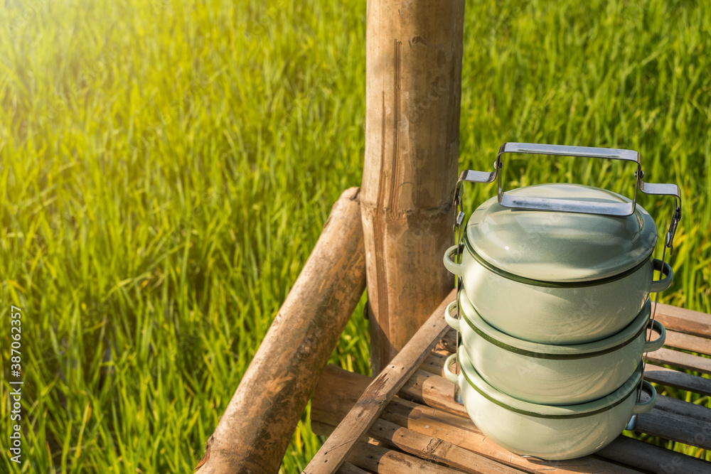 Fototapeta premium Zinc coated food carrier in Thailand countryside, beautiful natural farm atmosphere in the morning