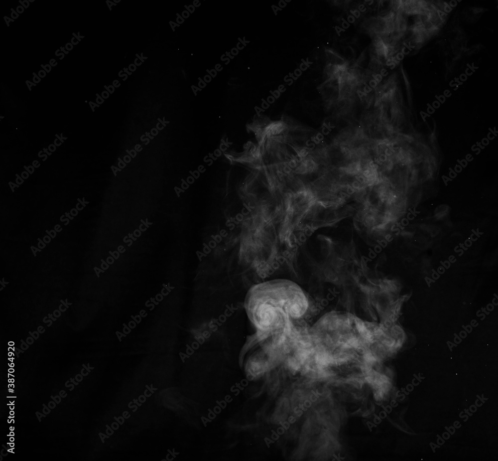 Figured smoke on a dark background. Abstract background, design element, for overlay on pictures Figured smoke on a dark background. Abstract background, design element, for overlay on pictures