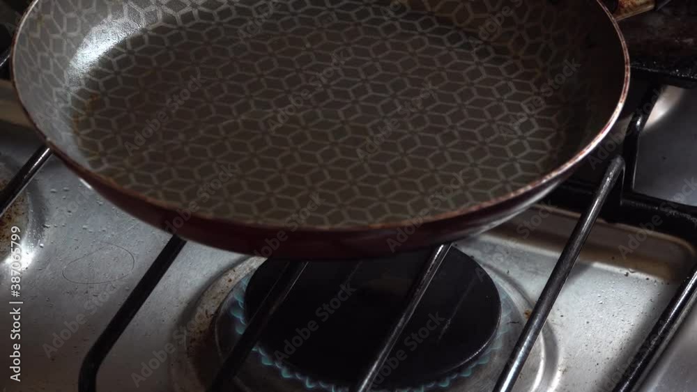 Oil heating on a pan.