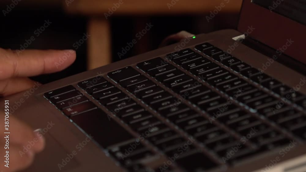 Hands typing on a keyboard.