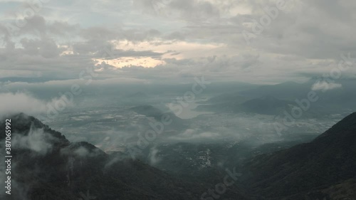 Drone aerial over the clouds, view of lake Amatitlan and mountains in Guatemala. photo