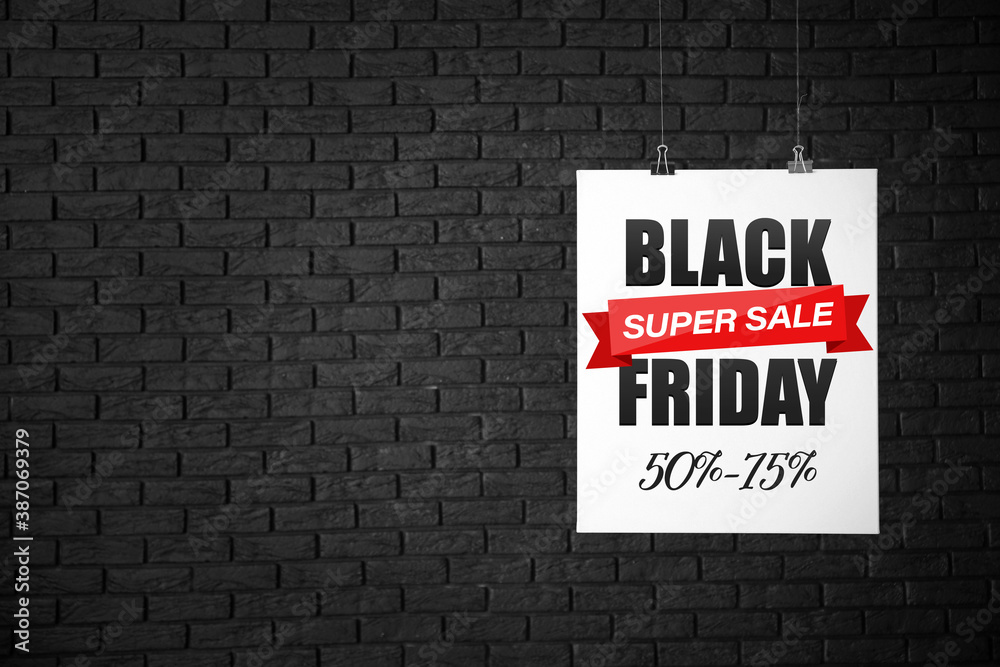 Poster with text BLACK SUPER SALE FRIDAY on dark brick background Poster with text BLACK SUPER SALE FRIDAY on dark brick background
