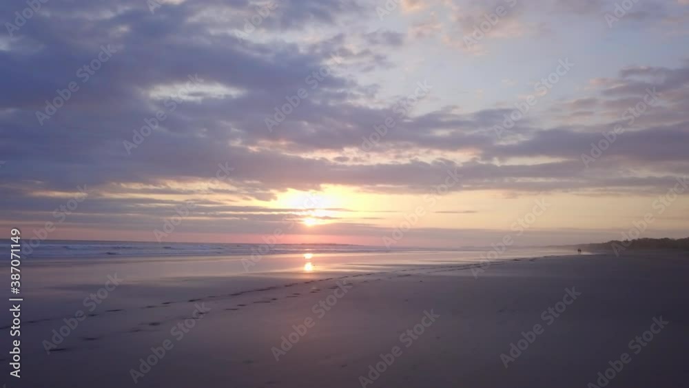 Tracking shot of footsteps in sand on Costa Rican beach during beautiful sunset Tracking shot of footsteps in sand on Costa Rican beach during beautiful sunset