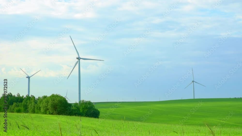 Wind turbine in field. Wind power energy concept. Renewable energy for climate protection Wind turbine in field. Wind power energy concept. Renewable energy for climate protection