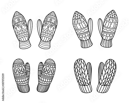 Set of knitted mittens isolated on a white background. Vector illustration in Doodle style. Design for New year and Christmas.
