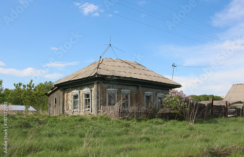 old wooden house in a deserted village in the summer of nonresidential real estate photo