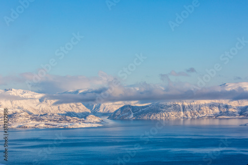 Beautiful winter landscape with mountains and fjord © sokko_natalia