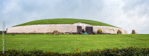 Drogheda, Ireland - July 15, 2020: Panoramic view of Newgrange prehistoric monument which is older than Stonehenge and the Egyptian pyramids. photo